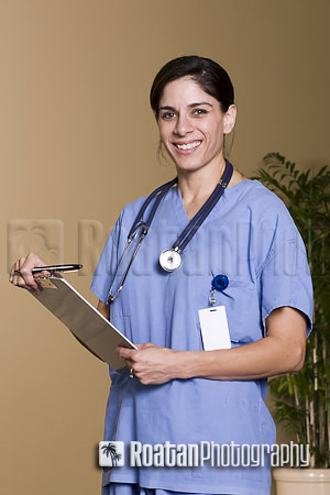 Female healthcare professional with clipboard and stethoscope stock photo